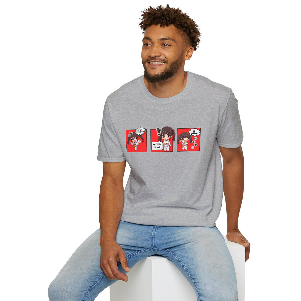 Are You Okay? unisex softstyle t-shirt in sport grey with chibi taekwondo girl three-panel comic strip graphic — "Aiyah!", "Are You Okay?", "Hi Mommy"