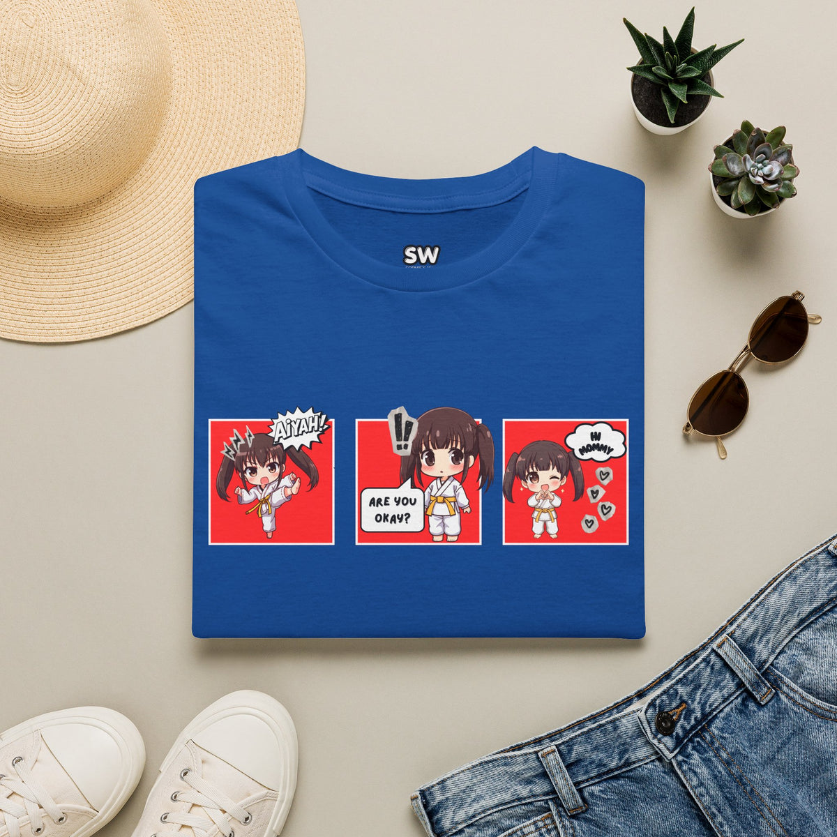 Are You Okay? unisex softstyle t-shirt in royal blue with chibi taekwondo girl three-panel comic strip graphic — "Aiyah!", "Are You Okay?", "Hi Mommy"