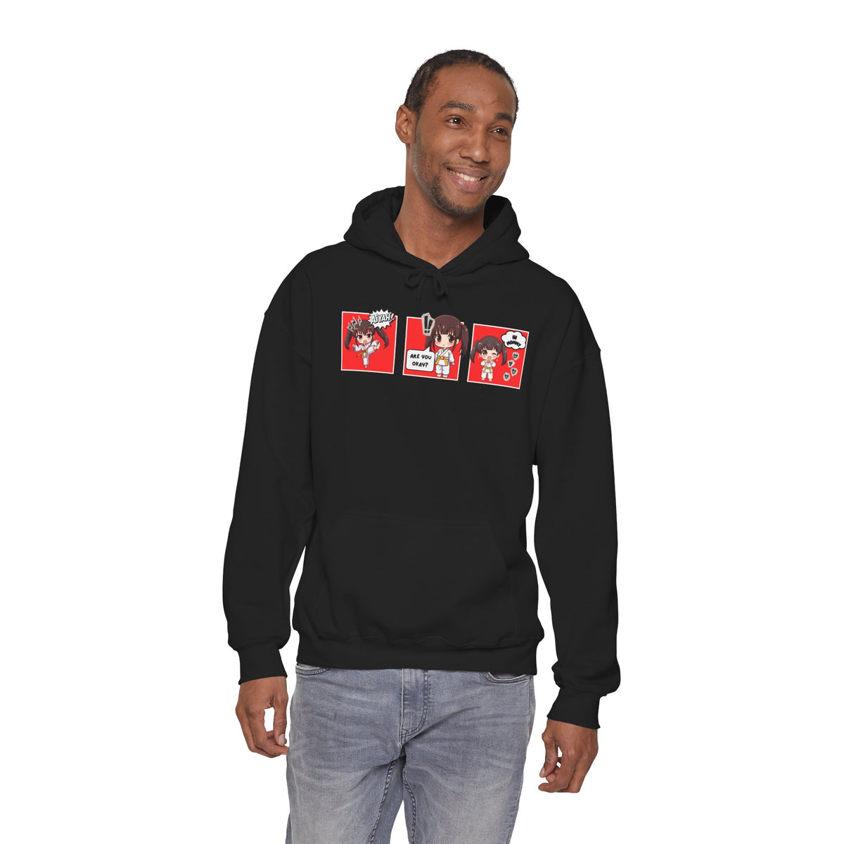 A black pullover hoodie with a red and multicolor anime-style graphic print on the chest of a taekwondo girl saying 'Aiyah!' then 'Are you okay?', and then 'Hi Mommy."