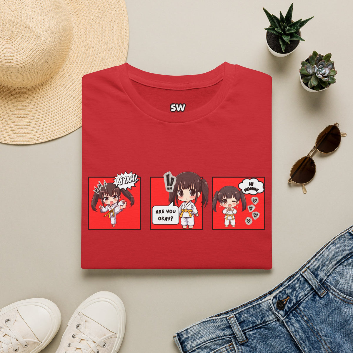 Are You Okay? unisex softstyle t-shirt in red with chibi taekwondo girl three-panel comic strip graphic — "Aiyah!", "Are You Okay?", "Hi Mommy"
