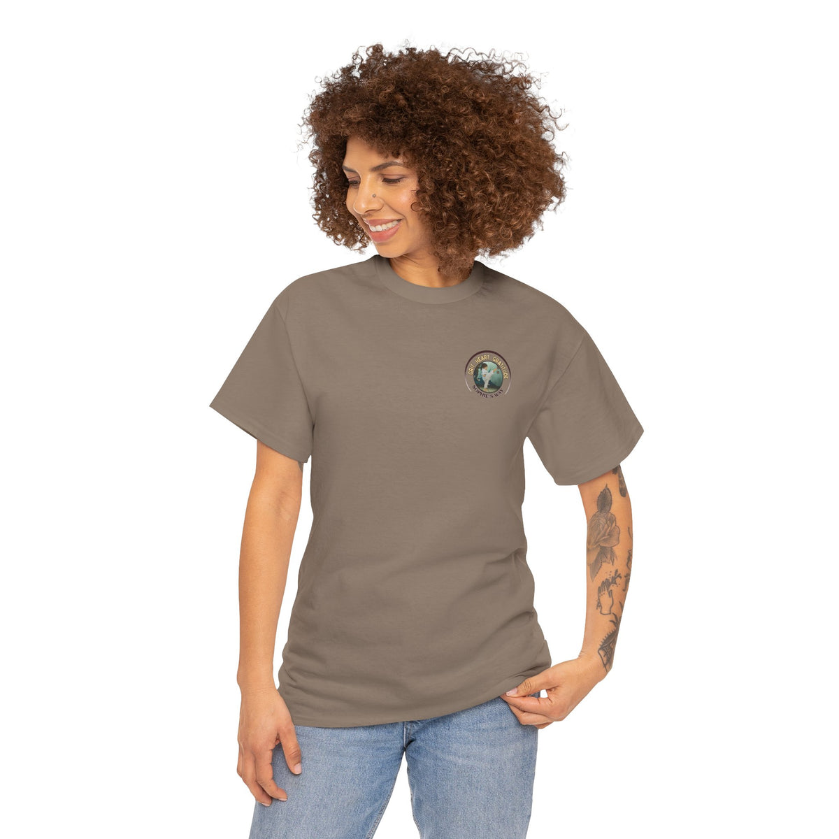 Brown savanna colored t-shirt with a small round logo of a taekwondo girl doing a side kick and the words Grit. Heart. Gratitude. Sophie's Way.