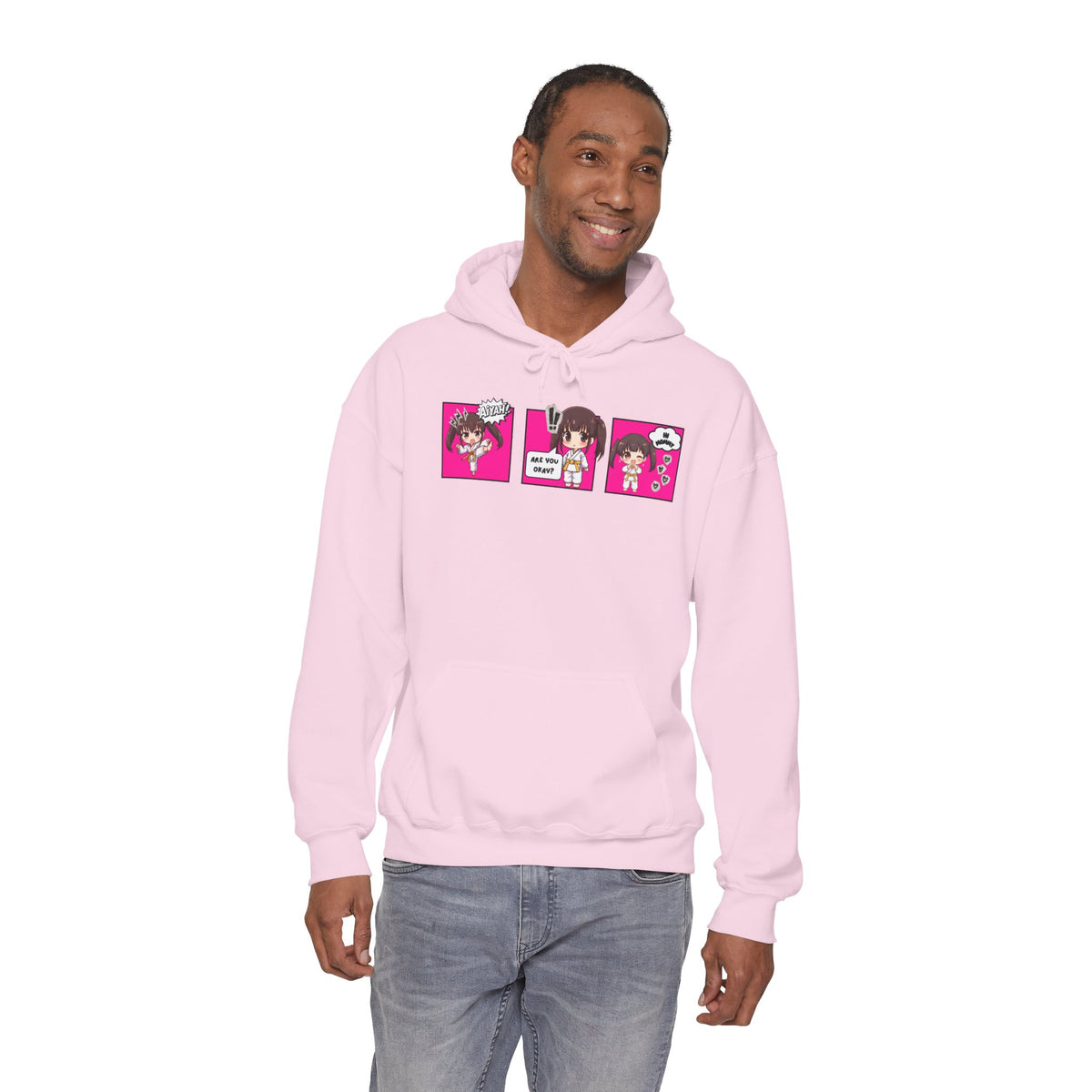 A pink pullover hoodie with a red and multicolor anime-style graphic print on the chest of a taekwondo girl saying 'Aiyah!' then 'Are you okay?', and then 'Hi Mommy.'