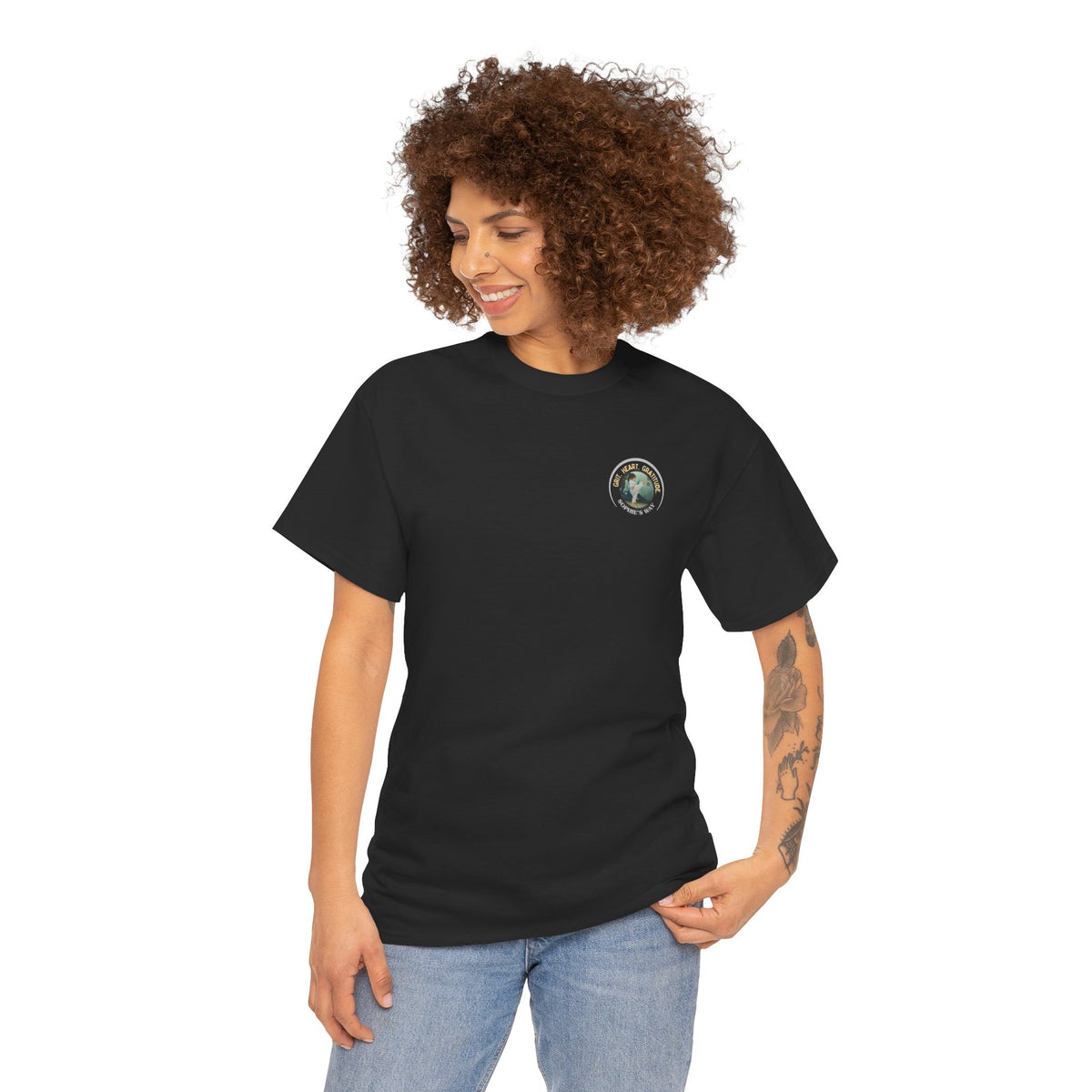 Black t-shirt with a small round logo of a taekwondo girl doing a side kick and the words Grit. Heart. Gratitude. Sophie's Way.