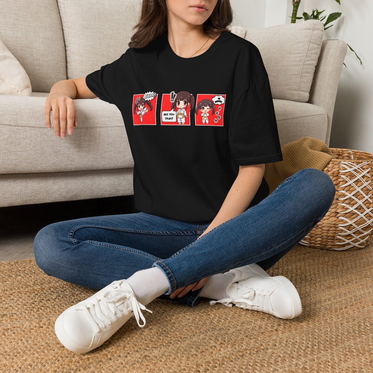 Are You Okay? unisex softstyle t-shirt in black with chibi taekwondo girl three-panel comic strip graphic — "Aiyah!", "Are You Okay?", "Hi Mommy"