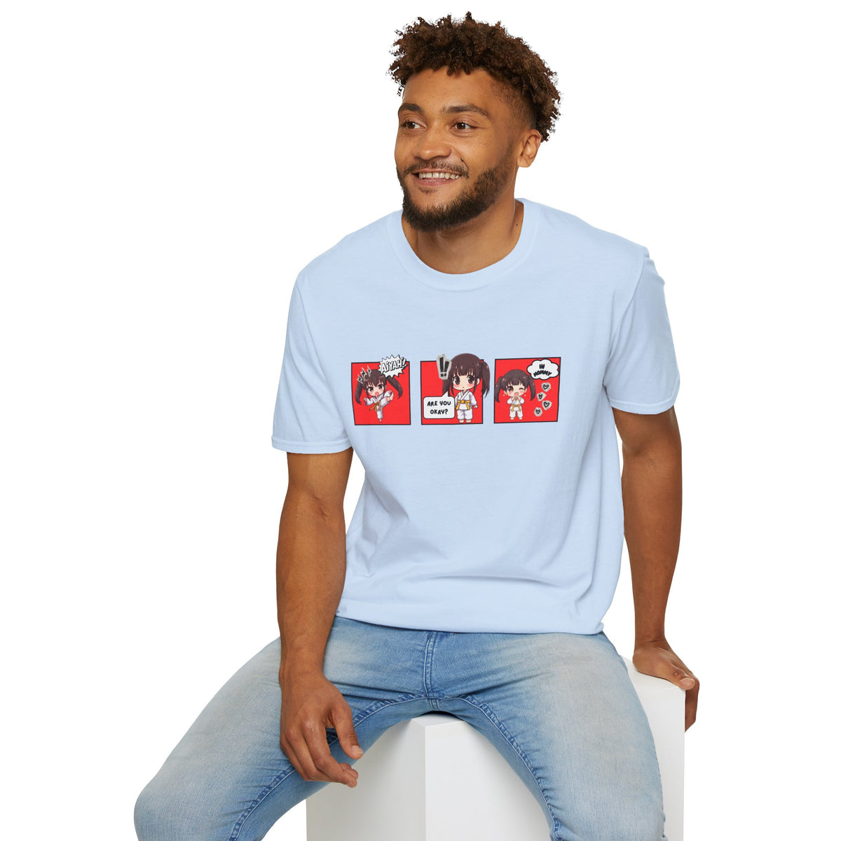 Are You Okay? unisex softstyle t-shirt in light blue with chibi taekwondo girl three-panel comic strip graphic — "Aiyah!", "Are You Okay?", "Hi Mommy"