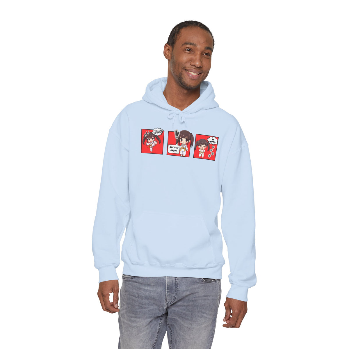 A light blue pullover hoodie with a red and multicolor anime-style graphic print on the chest of a taekwondo girl saying 'Aiyah!' then 'Are you okay?', and then 'Hi Mommy.'