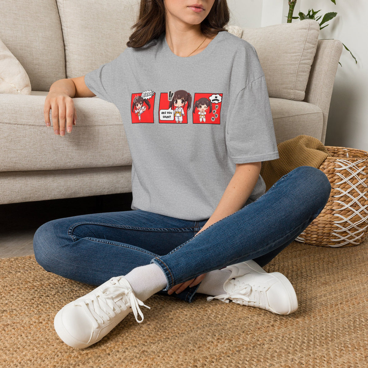 Are You Okay? unisex softstyle t-shirt in sport grey with chibi taekwondo girl three-panel comic strip graphic — "Aiyah!", "Are You Okay?", "Hi Mommy"